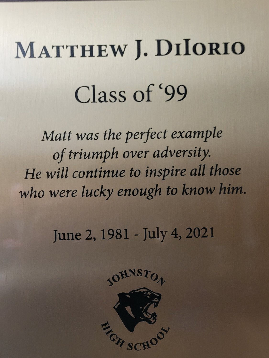 IN MEMORY: A plaque in memory of Matthew DiIorio now hangs behind the circulation desk in the Johnston High School library.